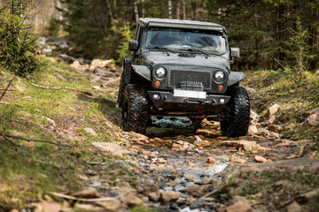 Fototapeta na wymiar off-road extreme expedition on black jeep wrangler