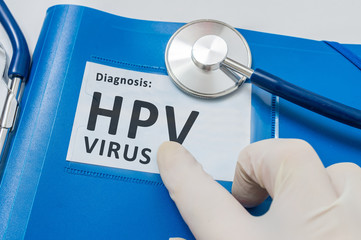 Blue folder with patient files with HPV virus diagnosis.