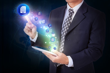 Businessman holding tablet with pressing mail pdf icon button. internet and networking concept