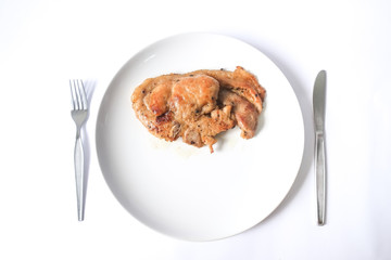 Chicken stek on white plate