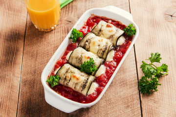 Baked eggplant with tomato sauce and cheese roll