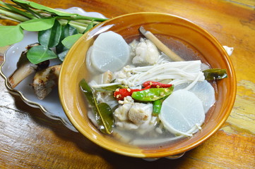 chicken leg with needle mushroom spicy and sour soup and mixed ingredient herb