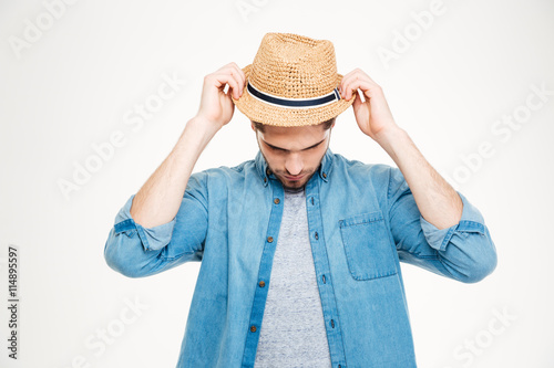 Handsome Young Man In Blue Shirt Putting On The Hat Imagens E Fotos how-long-after-my-hair-transplant-can-i-wear-a-hat-4k-youtube