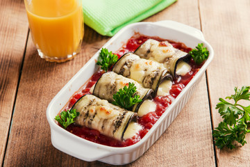 Baked eggplant with tomato sauce and cheese roll