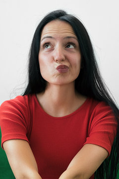 Portrait Of Beautiful And Pensive Woman Looking Up