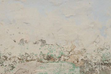 Wall fragment with scratches and cracks