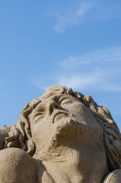 TAIPEI, TAIWAN - July 2, 2016: Fulong International Sand Sculpture Arts Festival at Fulong beach. Man's face sculpture.
