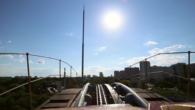 Rollercoaster train is moving before descending
