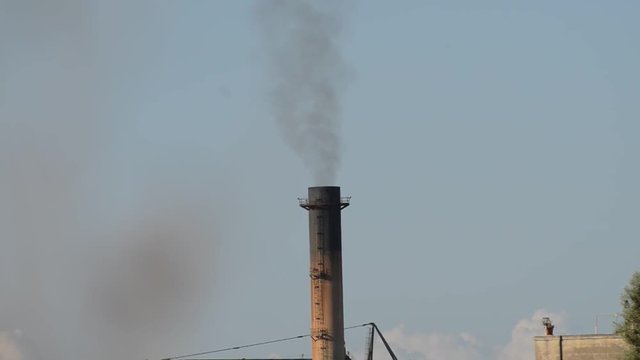 Black smoke from the chimney near Valetta, Malta