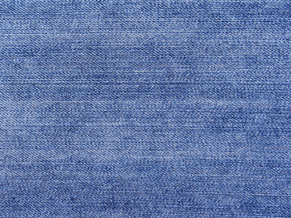 Naklejka premium Texture of blue jeans textile close up