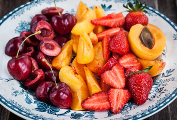  Plate of fresh juicy sliced fruits