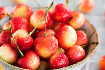 Bowl of fresh wet pink cherry