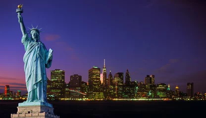 Wall murals Statue of liberty Manhattan skyline at night and Statue of Liberty.