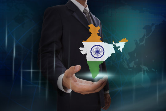 Businessman Showing Map Of India On Globe Background