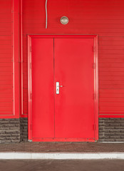 Red door on a red wall