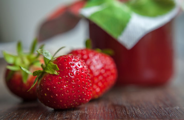 strawberry jam glass and berries homemade