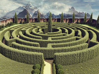 Okrągły ogrodowy labirynt na tle górskiego krajobrazu - obrazy, fototapety, plakaty