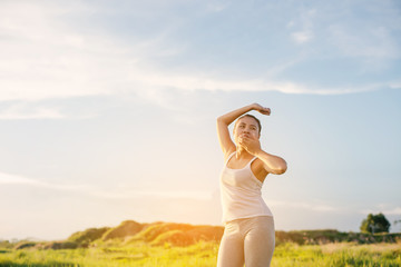 Beautiful young yoga women stretch her hand and yawning in the m