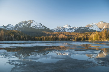 Lovely panorama in the mountains. High tops. In the foreground the beautiful lake.