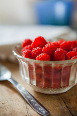 Raspberry Fruits in the kitchen prepared to eat in a ball on a woodn plate