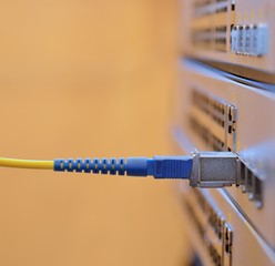 Optic fiber and SFP connected to switch.