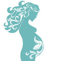 pregnant woman with vintage ornament in turquoise color