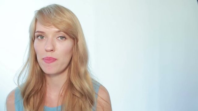 beautiful young woman eating a stick of celery
