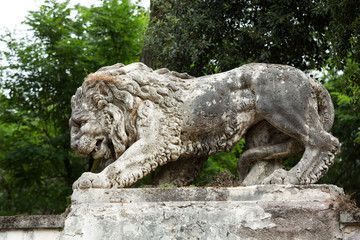 Fototapeta na wymiar Lion sculpture in Garden of Villa Borghese. Rome, Ital