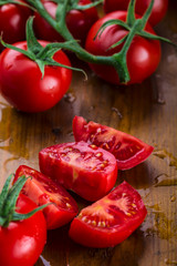 Fresh cherry tomatoes washed clean water. Cut fresh tomatoes.