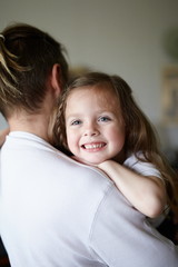 Daddy and daughter hugging and cuddling together