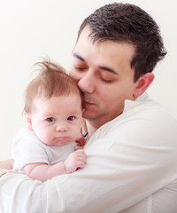 Happy Family,Young father holding his newborn baby 