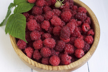 Red raspberries in a wooden bowl