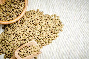 Fototapeta premium lentils, on table cloth, background, close up.