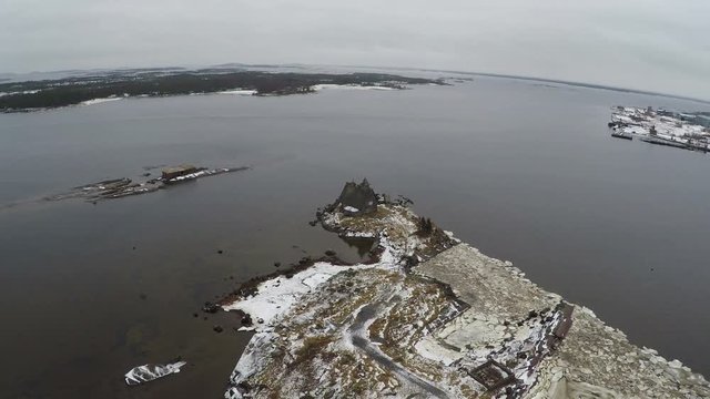 Bird eye view of old wooden house by White sea, on the mainland of Solovetsky islands