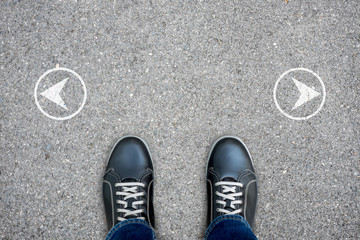 Fototapeta premium Black casual shoes standing at the cross road