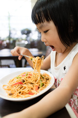 Asian Little Chinese Girl Eating spaghetti