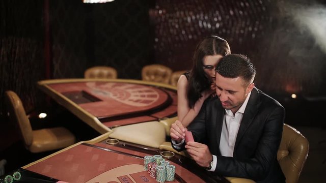Couple makes a big bet in blackjack in casino
