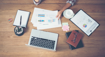Top view of young  Businessman woman hands reviewing analyzing f