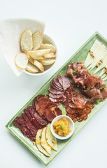 spanish serrano ham chorizo sausage and cheese tapas platter