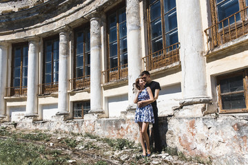 Nice young couple embracing in summer park