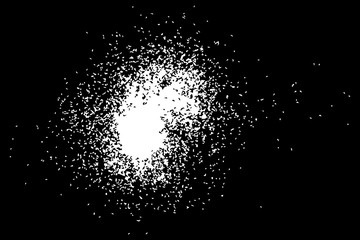 Abstract grainy texture isolated on black background. Silhouette of food flakes such as salt or almond or wheat flour spread on the flat surface or table. Top view. Dust, sand blow or bread crumbs.