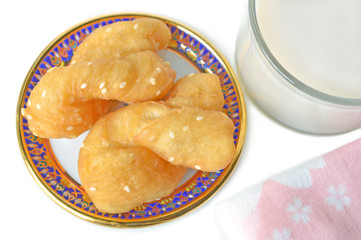 Chinese cruller and soy milk on white background