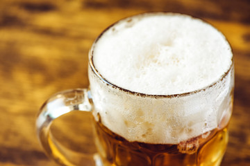 Beer mug full of cold fresh alcohol drink