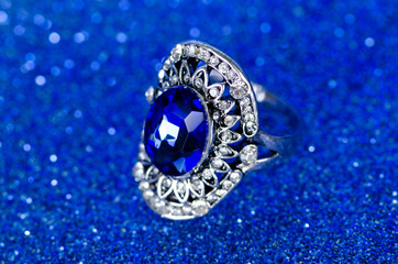 Jewellery ring against blue background