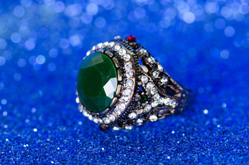 Jewellery ring against blue background