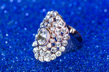 Jewellery ring against blue background