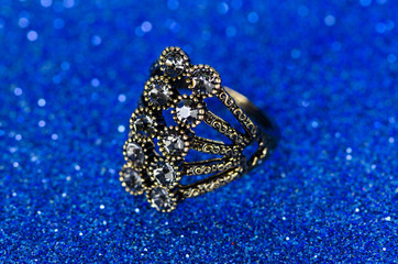 Jewellery ring against blue background