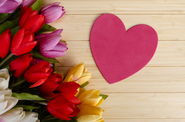 Obraz na płótnie Canvas Tulips flowers arranged with copyspace for your text