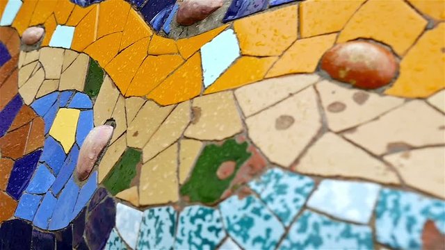 Details of the arch of colonnaded footpath in Antoni Gaudi's Park Guell, Barcelona, Spain