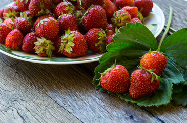Fresh ripe strawberries on a wooden table